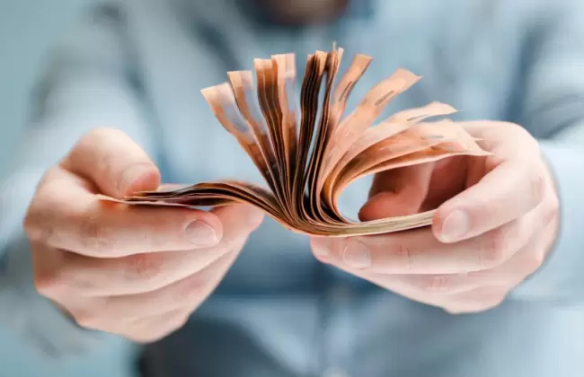 front-view-of-person-holding-money-2